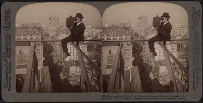 Photographing New York City - on a slender support 18 stories above pavement of Fifth Avenue[man with a camera].